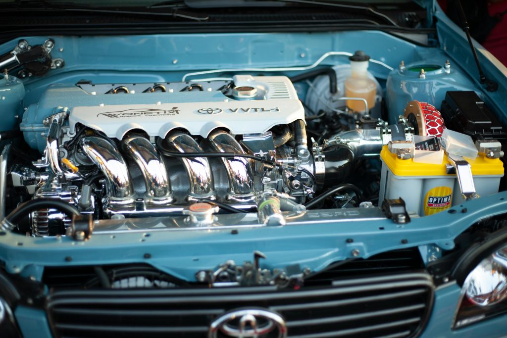 Detailed view of a shiny and powerful Toyota engine, showcasing automotive engineering.